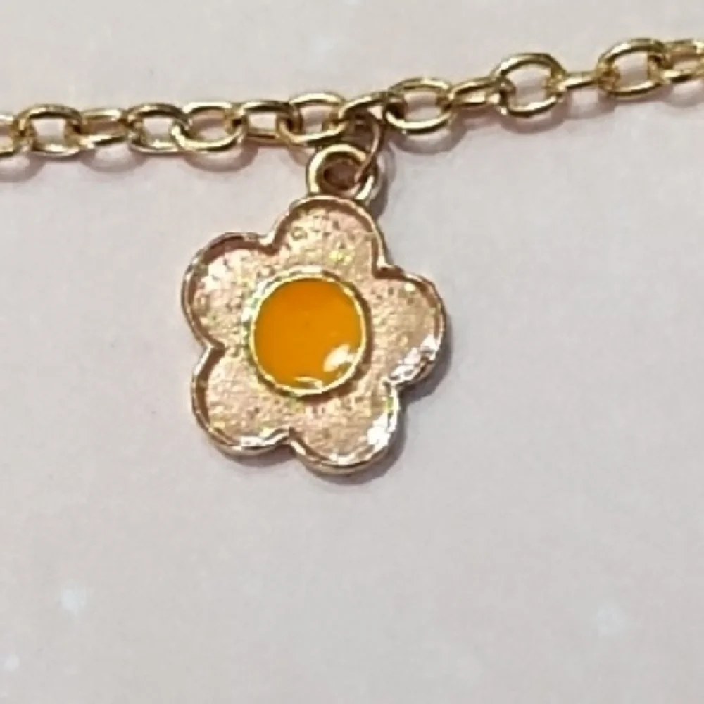 Gold Tone Metal Flower, Faux Pearl And Metal Smiley Face Charm Bracelet Lobster